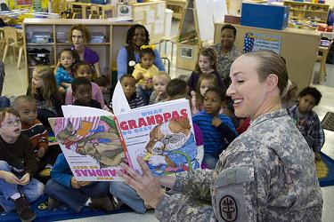 Soldier reading to children